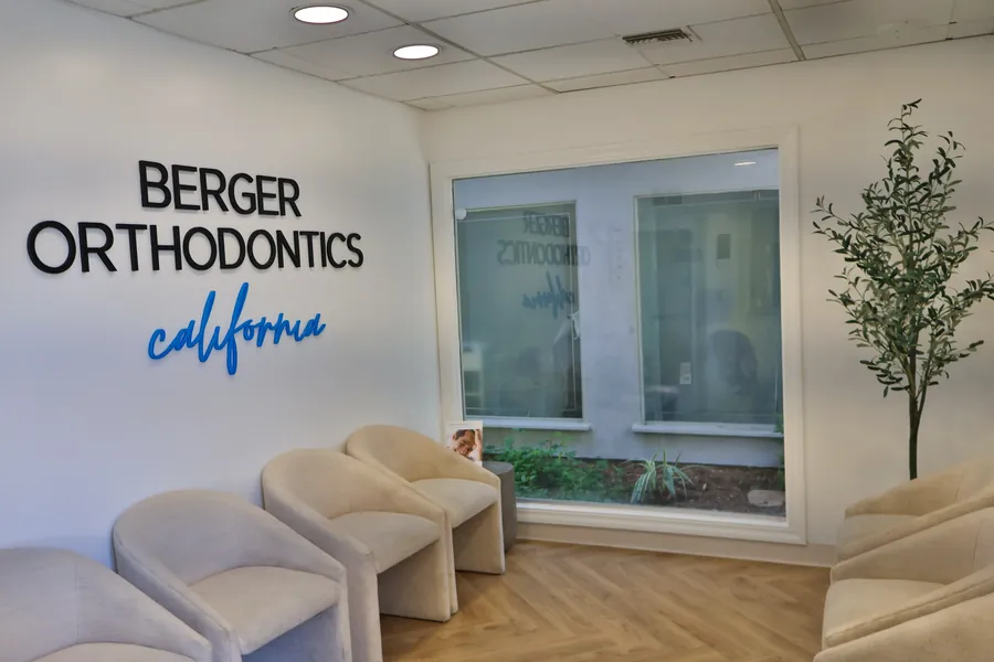 Berger Orthodontics waiting room with Berger Orthodontics California wall sign and comfortable seating